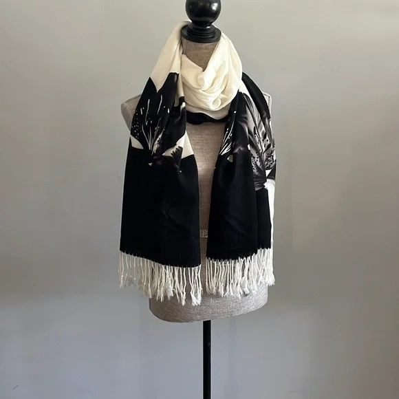 Lightweight scarf/wrap.  Cream and black with floral details.  Fringe on the end