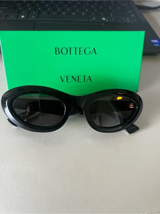 Bottega Veneta Black Oval Sunglasses with Dark Lenses