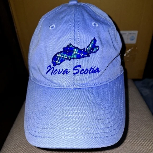 A Nova Scotia ball cap with adjustable strap.Light blue with embroidery