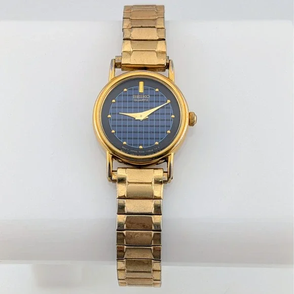 Vintage Seiko 1N00-0F60 Blue Woven Grid Textured Dial Gold Tone Watch 20mm