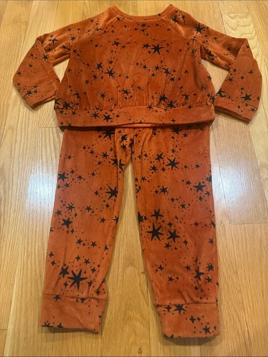 Cat & Jack rust orange velour set with black star pattern size xsmall.