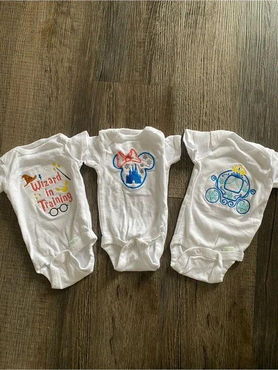 Home embroidered baby bodysuits