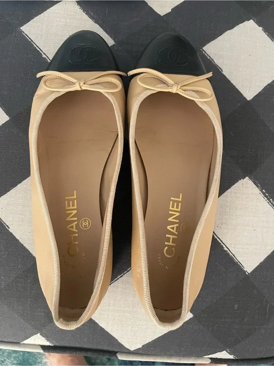 CHANEL Beige Leather Ballet Flats with Black Cap Toe and Bow