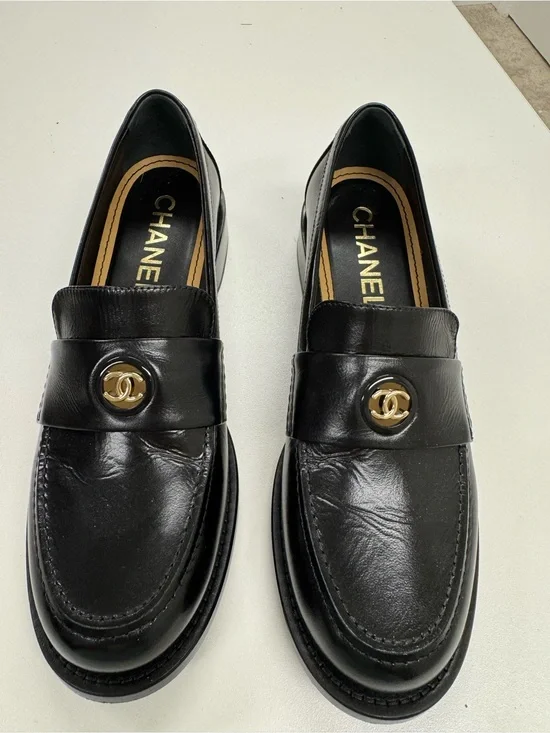 CHANEL Black Leather Loafers with Gold CC Medallions