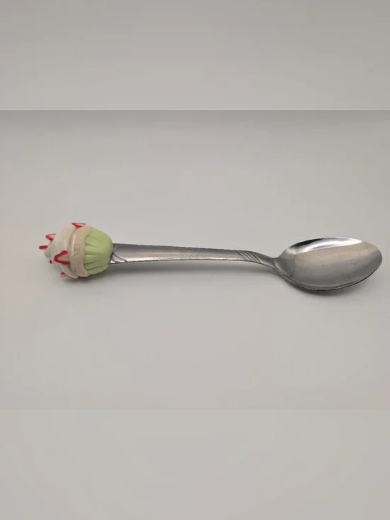 Dessert Spoon With A Strawberry Cupcake On Top