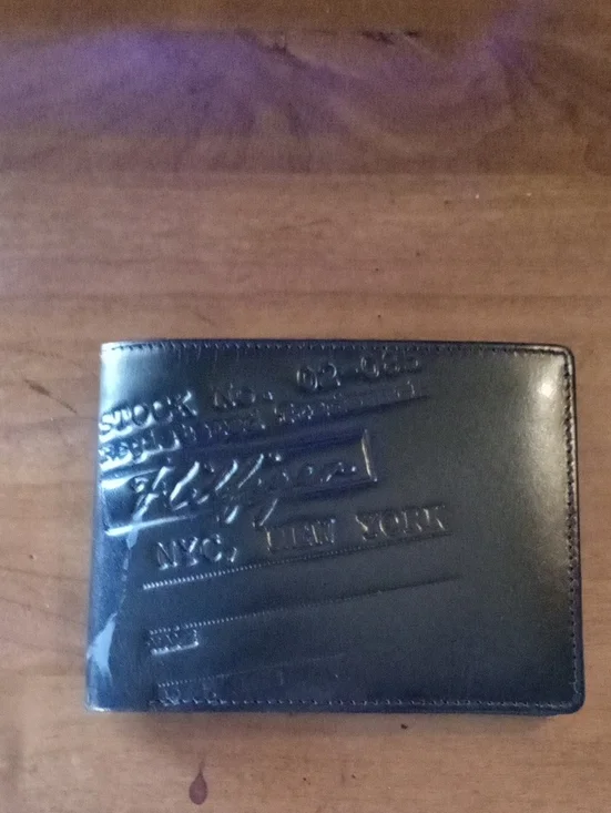Tommy Hilfiger Black Embossed Leather Bi-Fold Wallet