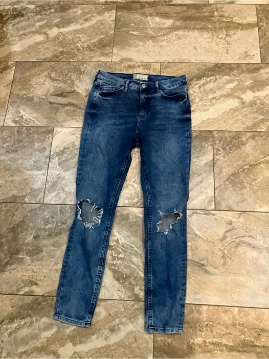 Free people busted knee skinny jeans