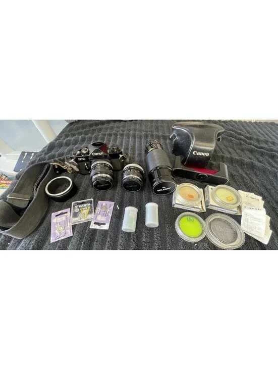 CANON F-1 FILM CAMERA WITH LENSES, CASE, FILM AND MORE  *TESTED, READ DESC*