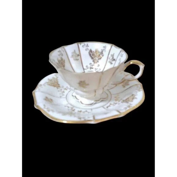 LINDNER Kueps Bavaria Demitasse Floral Footed Gold Gilt Porcelain Cup/Saucer