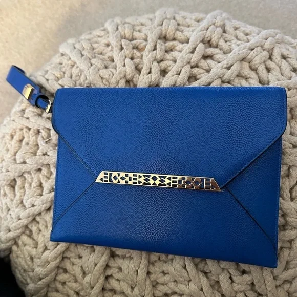 Stella and Dot wristlet never used. Great sailor blue color with gold accent