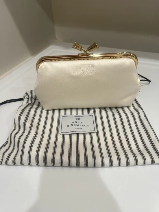 Anya Hindmarch Ivory Satin Kiss-Lock Wristlet Clutch with personalized letter