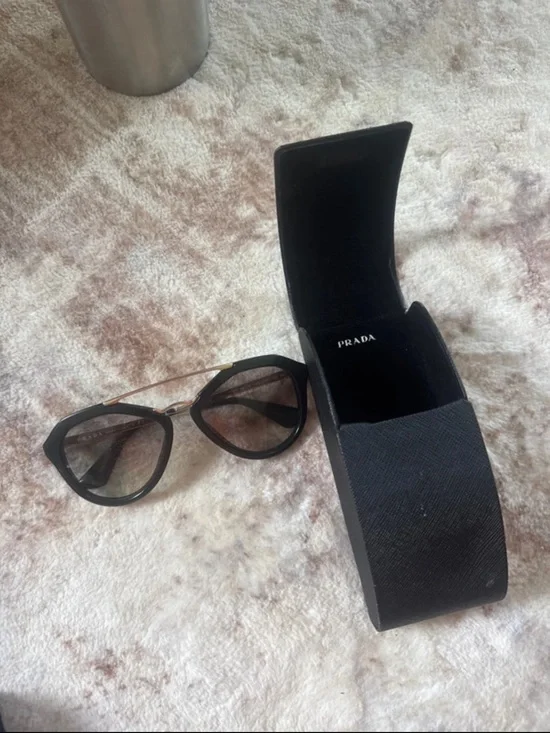 Prada Black Cat-Eye Sunglasses with Gold Bridge