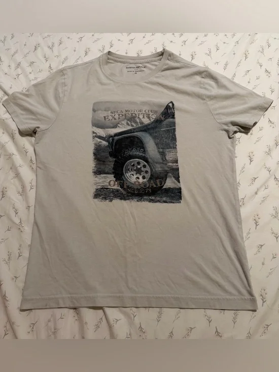 Off white tee with truck graphic