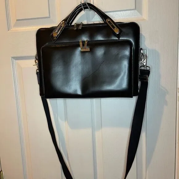 Abbi New York Laptop/Briefcase Carrier Black leather inside padded fabric.
