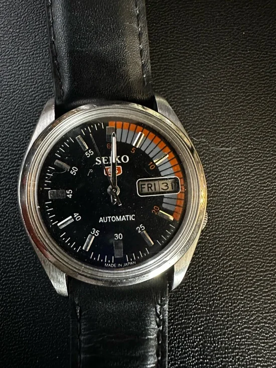 Seiko Black Dial Watch with Orange and Gray Accents