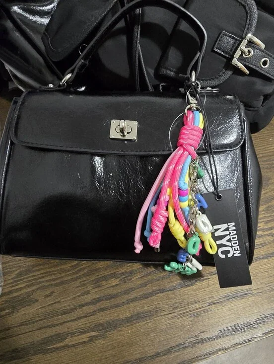 Black Patent Top-Handle Bag with Colorful Tassel Charm Madden NYC