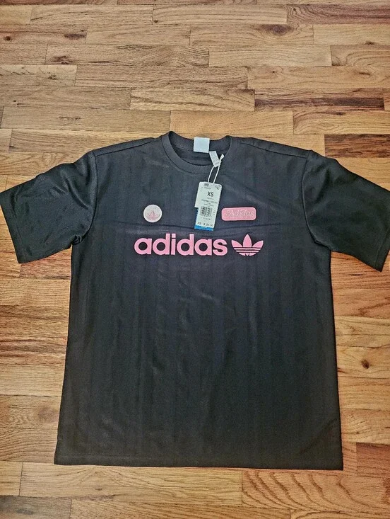 OVERSIZED. FITS LIKE A SMALL. Adidas Black Short Sleeve Tee with Pink Logo