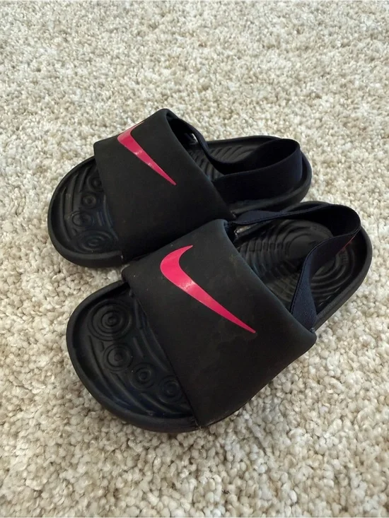 Nike Kids Black Slide Sandals with Pink Swoosh Accent
