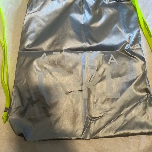 Athletta girl silver and neon green  cinch sack. Used, but life left in it.