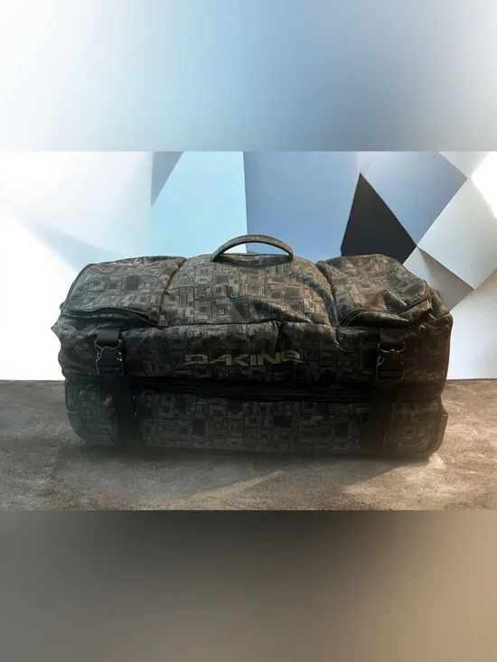 Dakine Split Roller 110L Wet Dry Duffel with a distinctive geometric pattern.