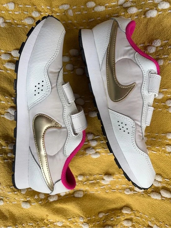 Nike White and Gold Kids Sneakers with Pink Accent
