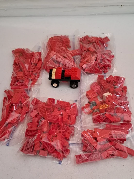 Loose Red Building Bricks Lot with Small Toy Vehicle