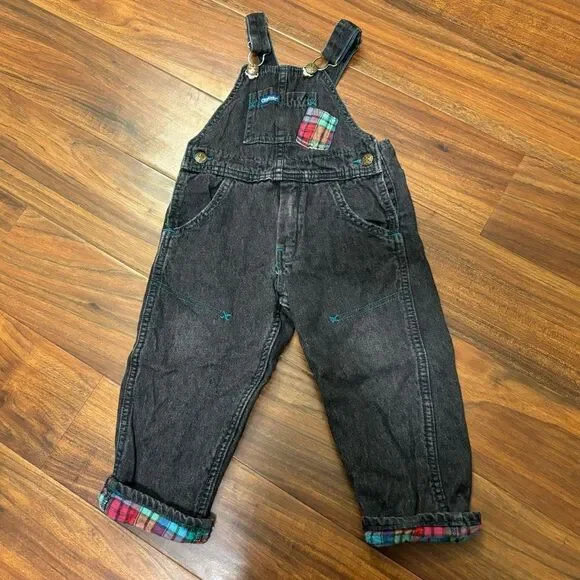 Osh Kosh B’Gosh Vintage black denim overalls with plaid accents.