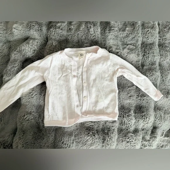 Light pink cardigan size 9-12M has a faint stain