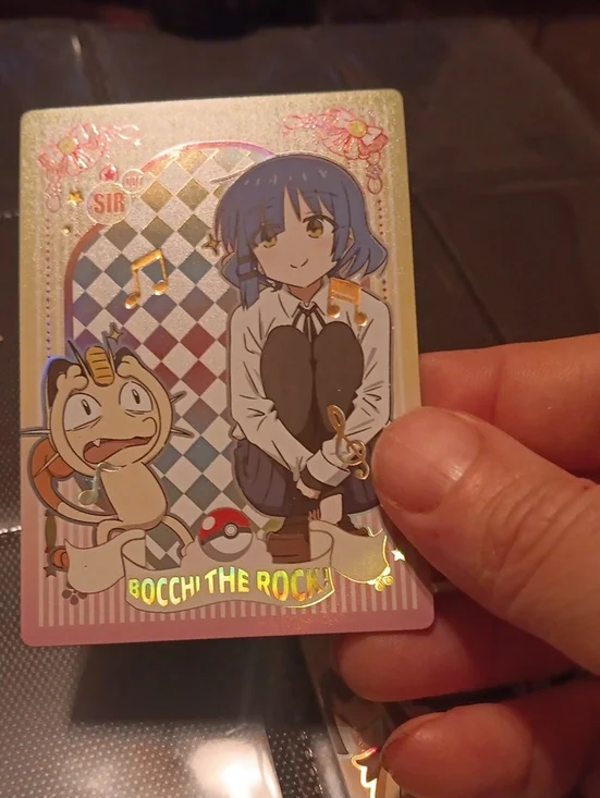 Pokemon Trading Card with Blue, Pink, Gold, White Artwork