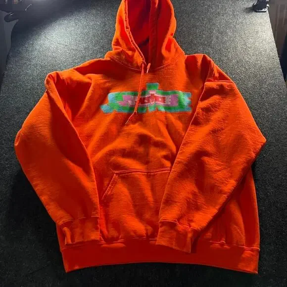 Justice orange hoodie with multicoloured design Size L