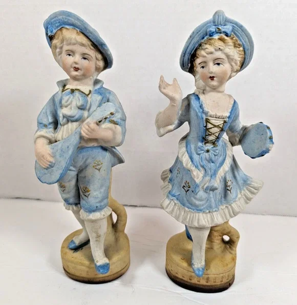 Vintage L & M INC. 8 1/2 '' TALL SET OF TWO BISQUE FIGURINES BOY & GIRL IN BLUE