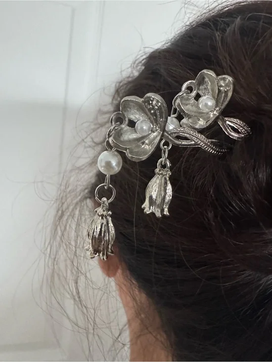 Hairpin is a silver toned