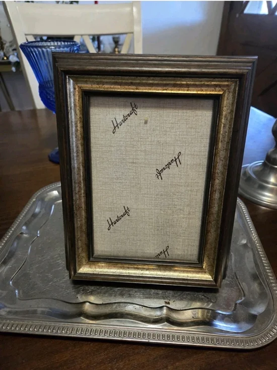 Vintage Hartcraft picture frame features a traditional brown wood finish