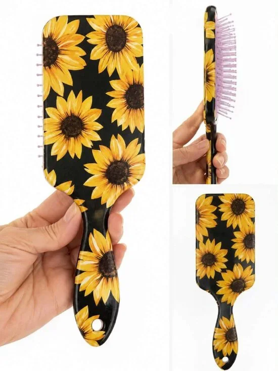 Black paddle hair brush