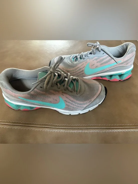 Nike Women's Light Gray Running Shoes with Teal and Coral Accents
