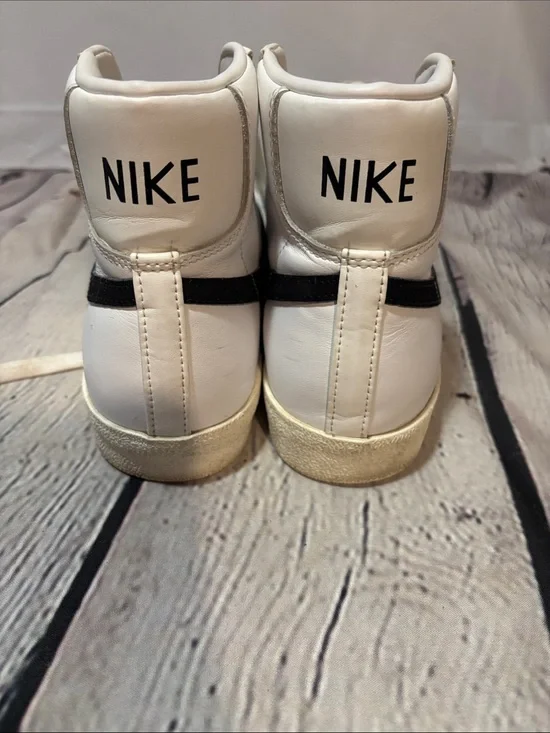 Nike White High-Top Sneakers with Black Stripe