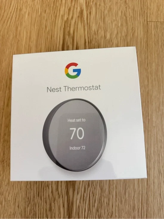 google Nest Thermostat - White Packaging with Gray Thermostat Image