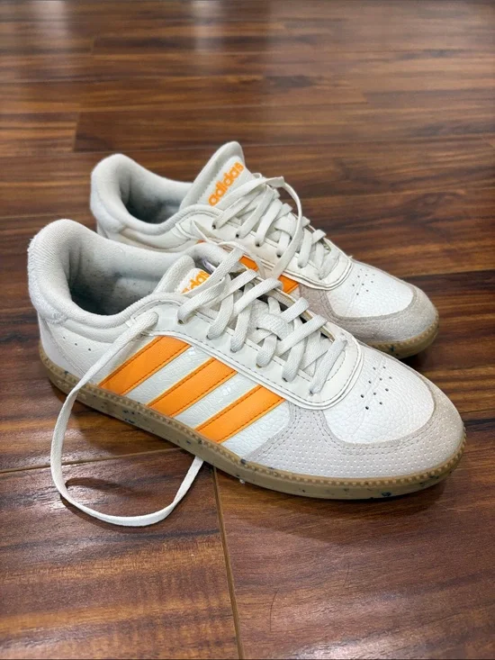 adidas Women’s White Sneakers with Orange Three-Stripes