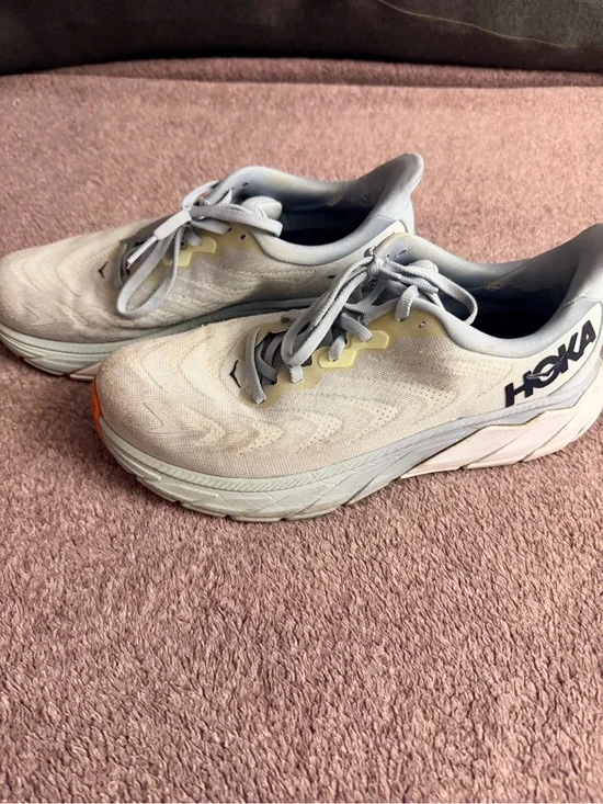 Hoka light gray and yellow running shoes