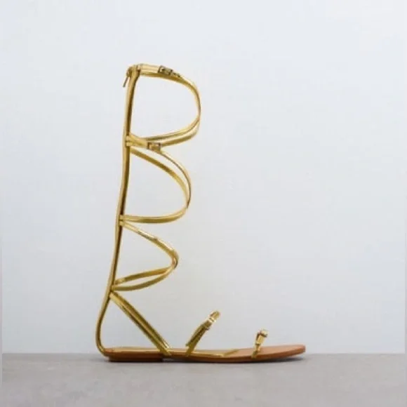 NWT. Zara Golden Strappy Flat Sandals with Buckle Details. Size 7,5.