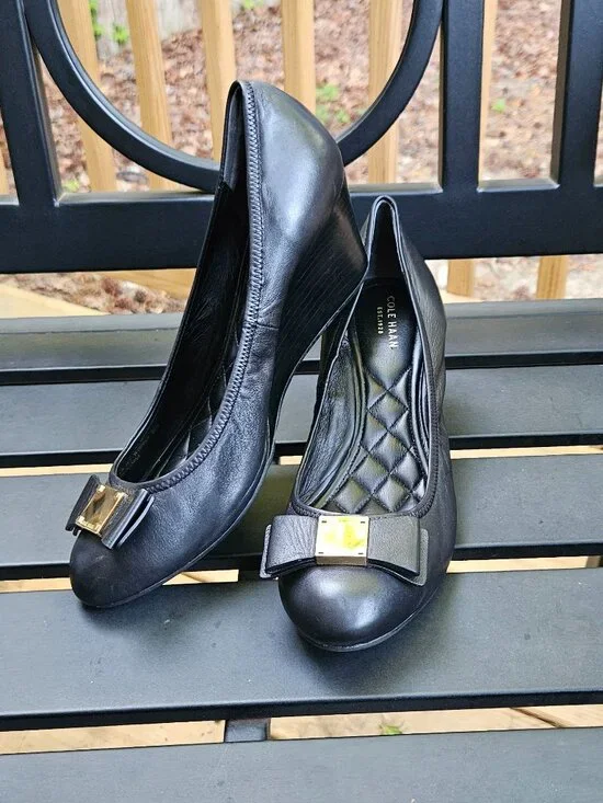 Cole Haan Black Leather Wedge Pumps with Gold Bow Accent