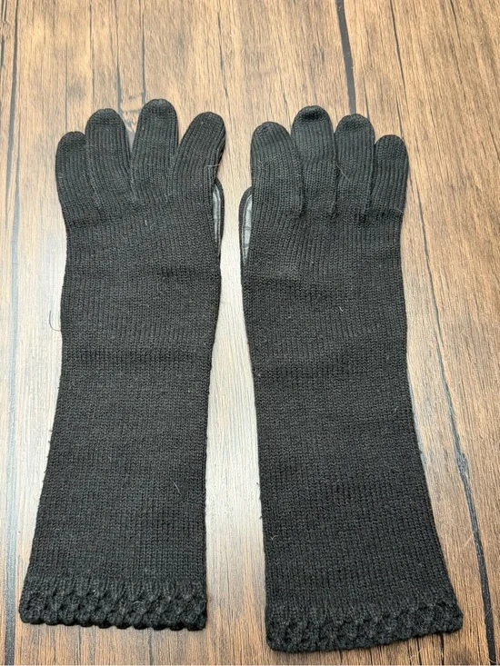 Vintage long black knit gloves featuring a textured cuff
