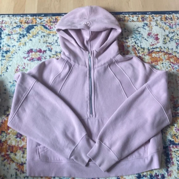 Women's jacket tag inside a pink hoodie