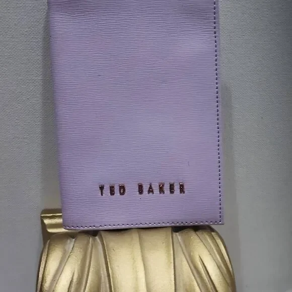 Ted Baker leather passport holder features rose gold foil branding.