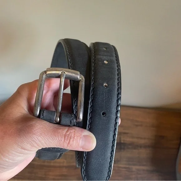 Eddie Bauer men’s black leather belt with silver tone  buckle.