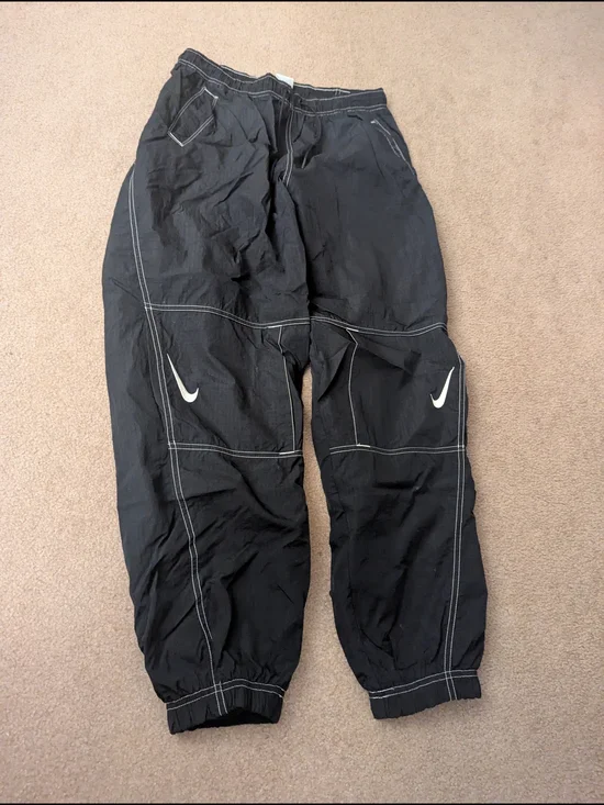 Nike Women's Black Athletic Track Pants with White Swoosh