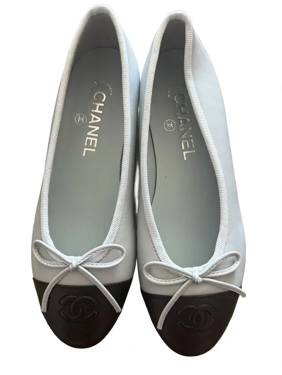 CHANEL Light Blue Leather Ballet Flats with Black Cap Toe and Bow
