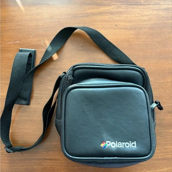 Like new black vintage Polaroid 600 camera bag.  Three pocket areas.