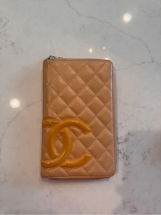CHANEL Quilted Zip Phone Wallet in Tan with Yellow CC Logo