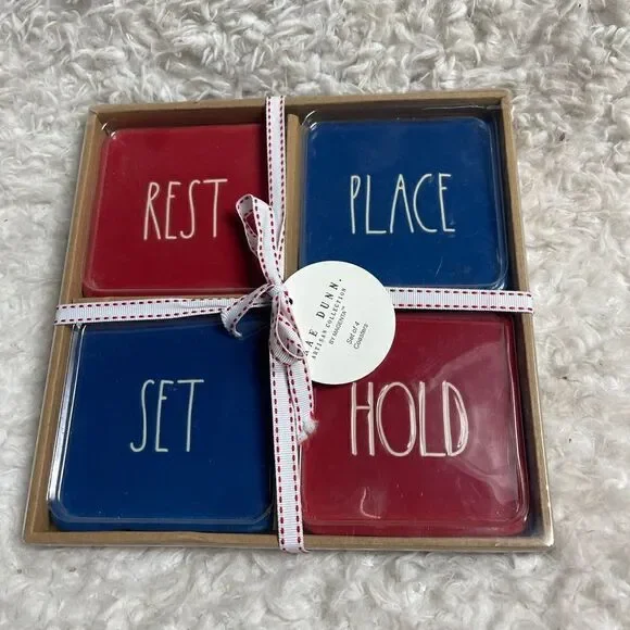 New in box Rae Dunn Ceramic Red & Blue Rest, Place, Stay, Hold Coasters .